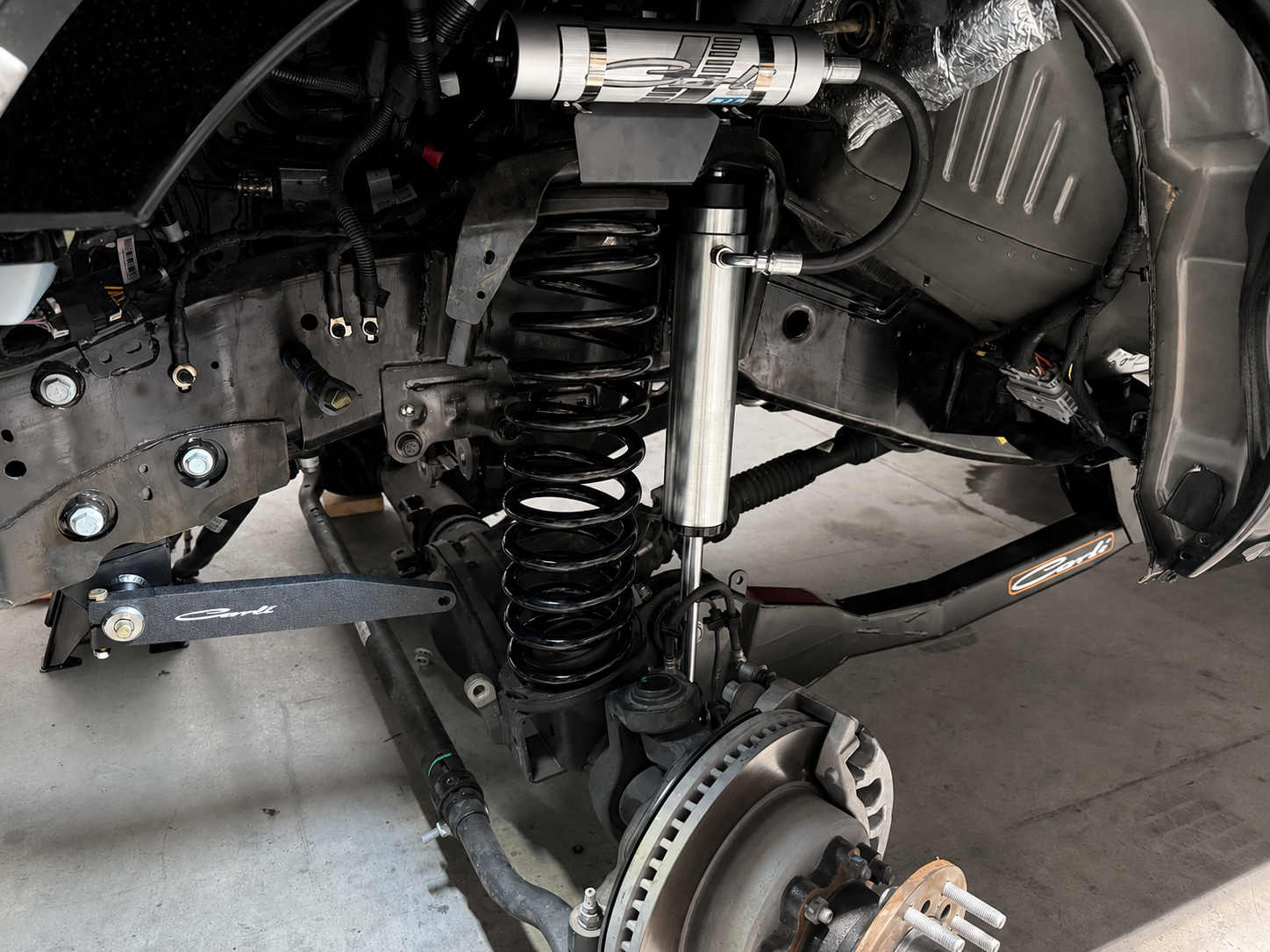 Professional truck suspension installation at Torque Ranch Motors